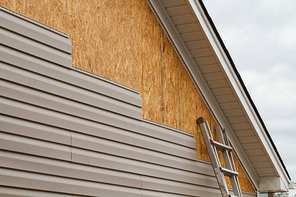 Professional Siding technician working in Wayland, MA